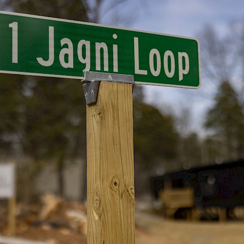 A green street sign reading 