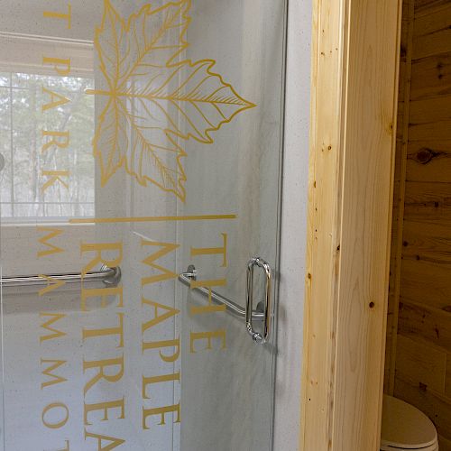 A shower with a transparent door, labeled 